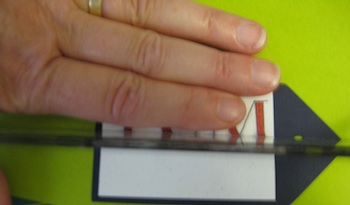 Fifth step in adhering letters